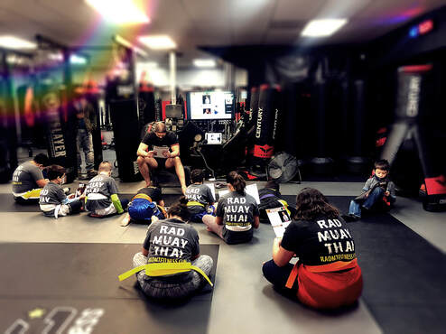 Youth Muay Thai Class during mat chat discussion about Respect
