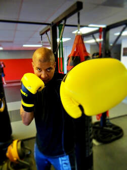 Yellow boxing glove rad muay thai